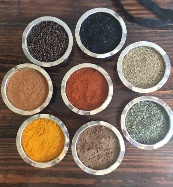 Selection of spices in bowls displayed on a table from the Nile restaurant