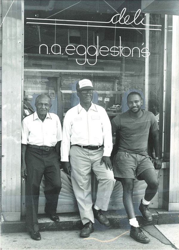 Image of the Eggleston Family in front of the Eggleston Hotel and Motel