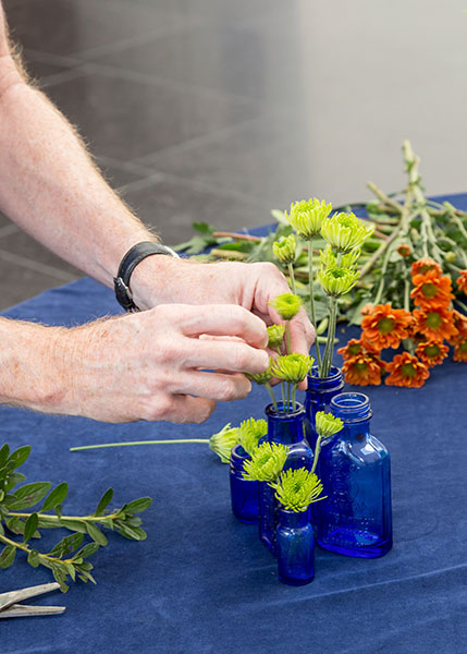 Arranging flowers in bottles