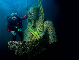 Diver underwater with Statue